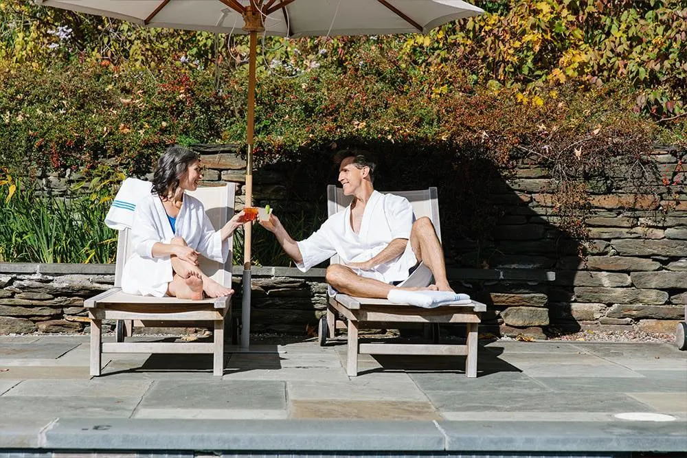 Couple poolside at The Porches Inn
